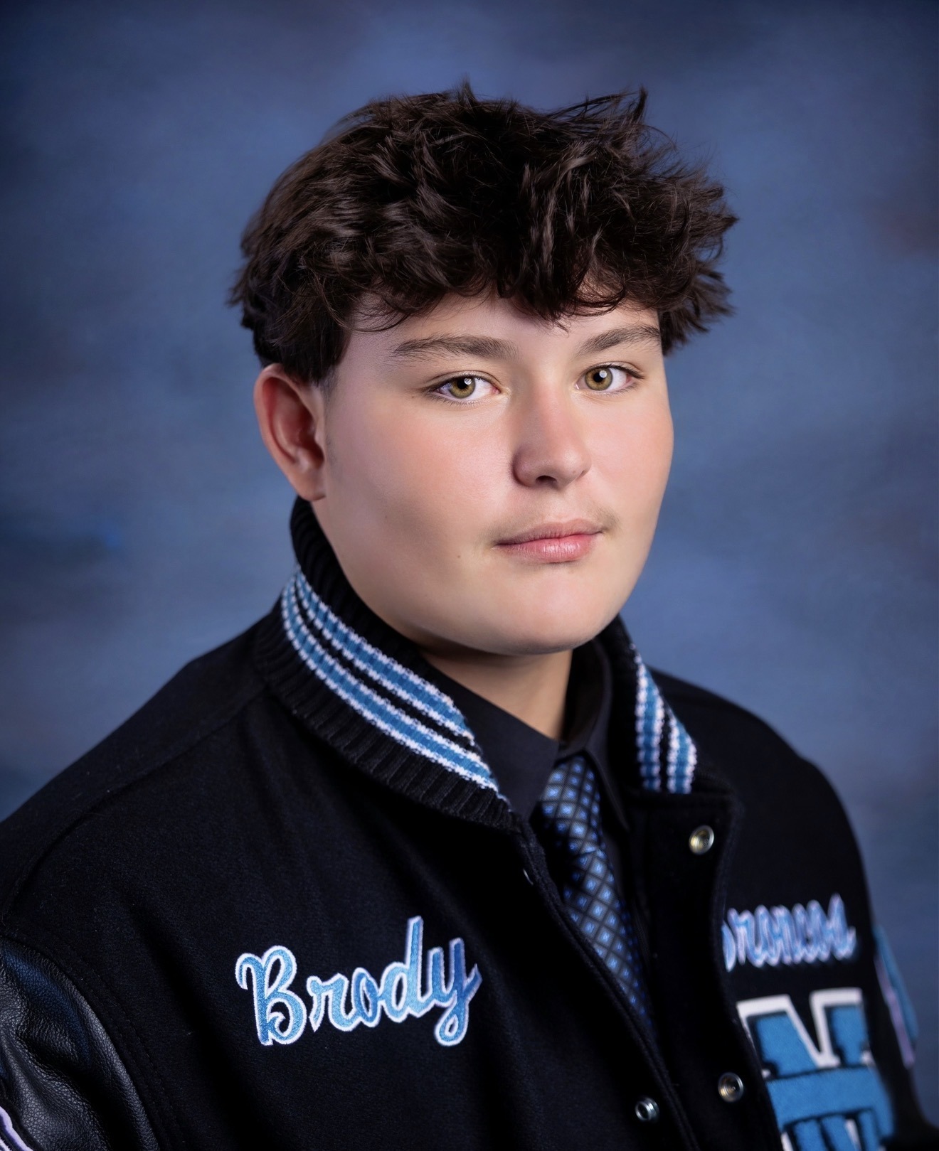Brody’s senior portrait in his Clovis North letterman jacket
